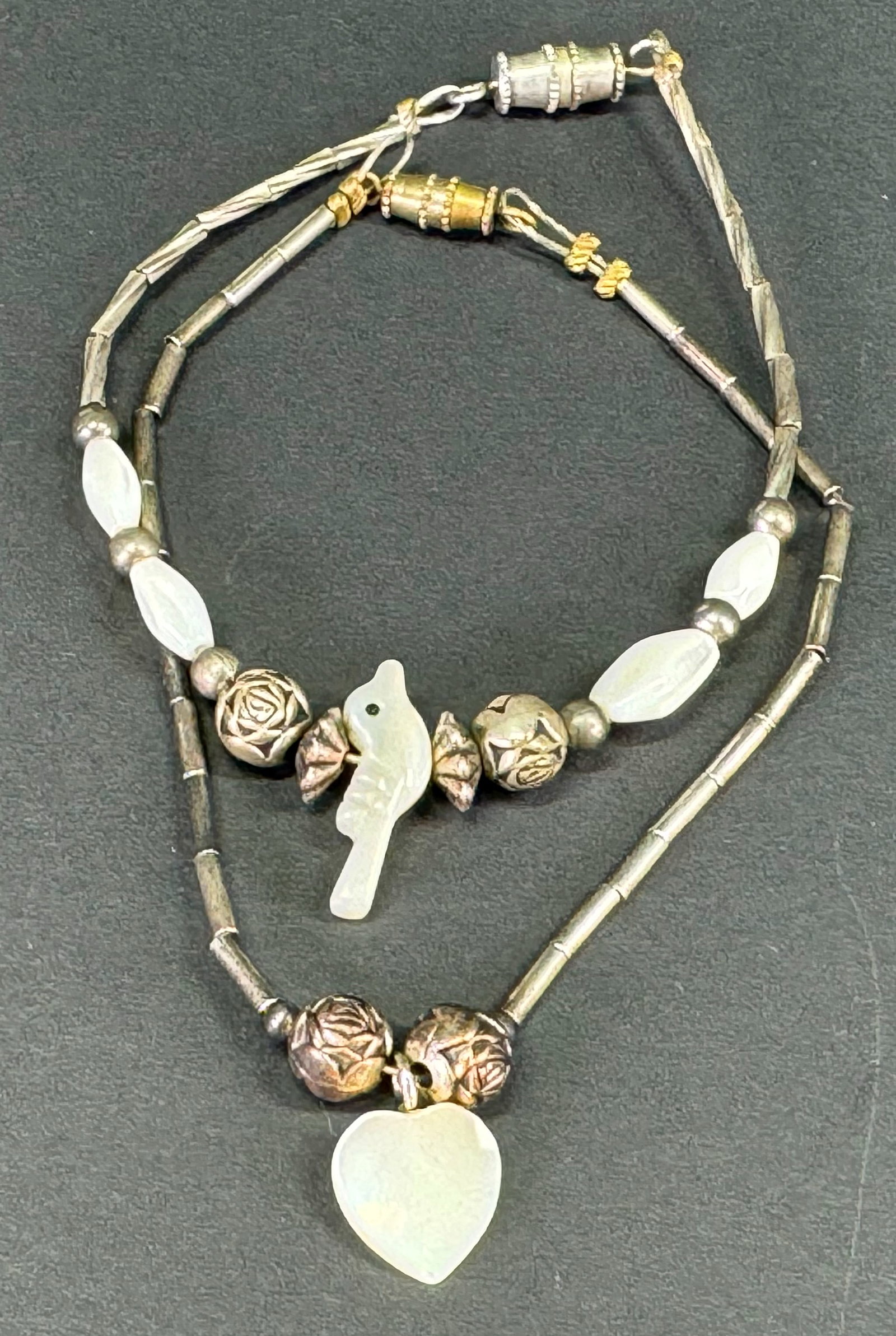 Vintage Native American style MOP Heart and bird fetish liquid silver bracelets.: Vintage Native American style MOP Heart and bird fetish liquid silver bracelets. Unmarked. For measures please refer to the pictures taken with a measuring tape. Weight: 7 Grams. . This is a NO RESERV
