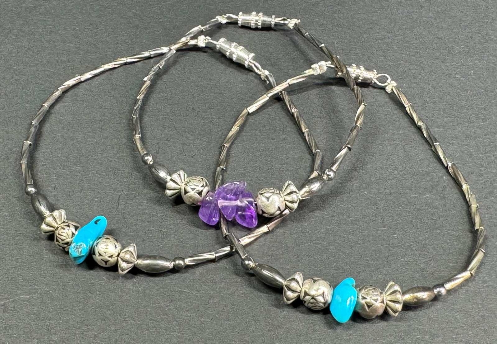 Vintage Native American style amethyst & turquoise chips liquid silver bracelets lot.: Vintage Native American style amethyst & turquoise chips liquid silver bracelets lot. All unmarked. For measures please refer to the pictures taken with a measuring tape. Weight: 7 Grams. This is a NO