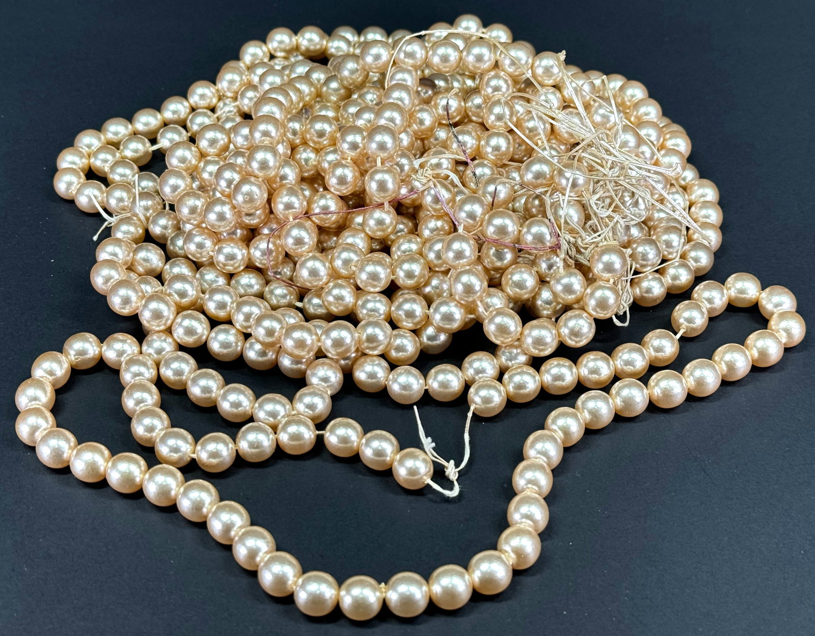 Vintage faux pearl beads strands for jewelry or craft making. Lot of 11. Each measures 20" long: Vintage faux pearl beads strands for jewelry or craft making. Lot of 11. Each measures 20 inches long. 1L 9 Oz For measures please refer to the pictures taken with a measuring tape. Shoes with stains 