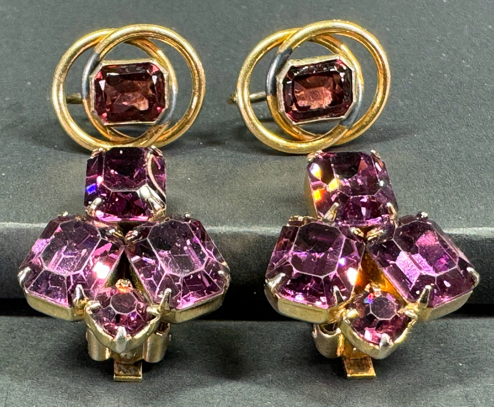 Vintage purple crystals goldtone metal screw back & Weiss clip earrings .: Vintage purple crystals goldtone metal screw back & Weiss clip earrings . Marked Weiss the clip ones and the screw ones 10K 1-20. For measures please refer to the pictures taken with a measuring tape.