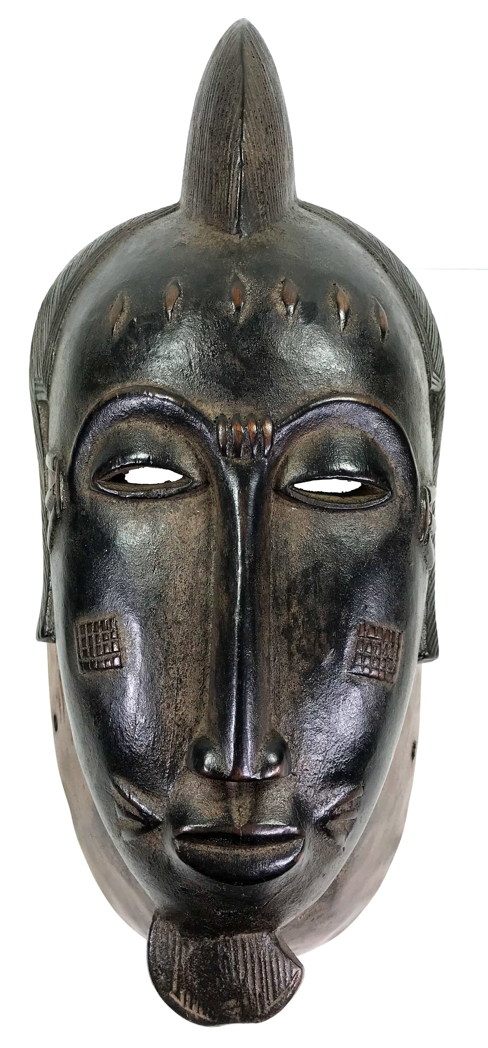 African Guro, Ivory Coast Mask.Carved wood: African Guro, Ivory Coast Mask. Carved wood. It measures 15 1/4 inches long and 6 3/4 inches widest. Weight: 2 Lbs 15 oz. This is a NO RESERVE AUCTION: there are no hidden or confidential reserves, al