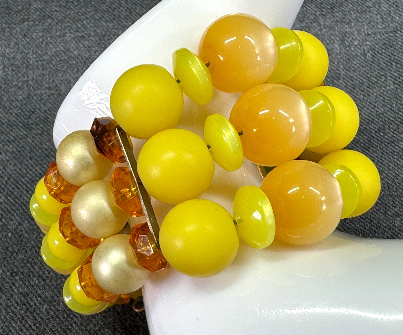 Vintage iridescent, mate, juicy & pearly lucite wired beads 3 strands wrap bracelet.: Vintage iridescent, mate, juicy & pearly lucite wired beads 3 strands wrap bracelet. Unmarked. For measures please refer to the pictures taken with a measuring tape. Weight: 35 Grams. This is a NO RES