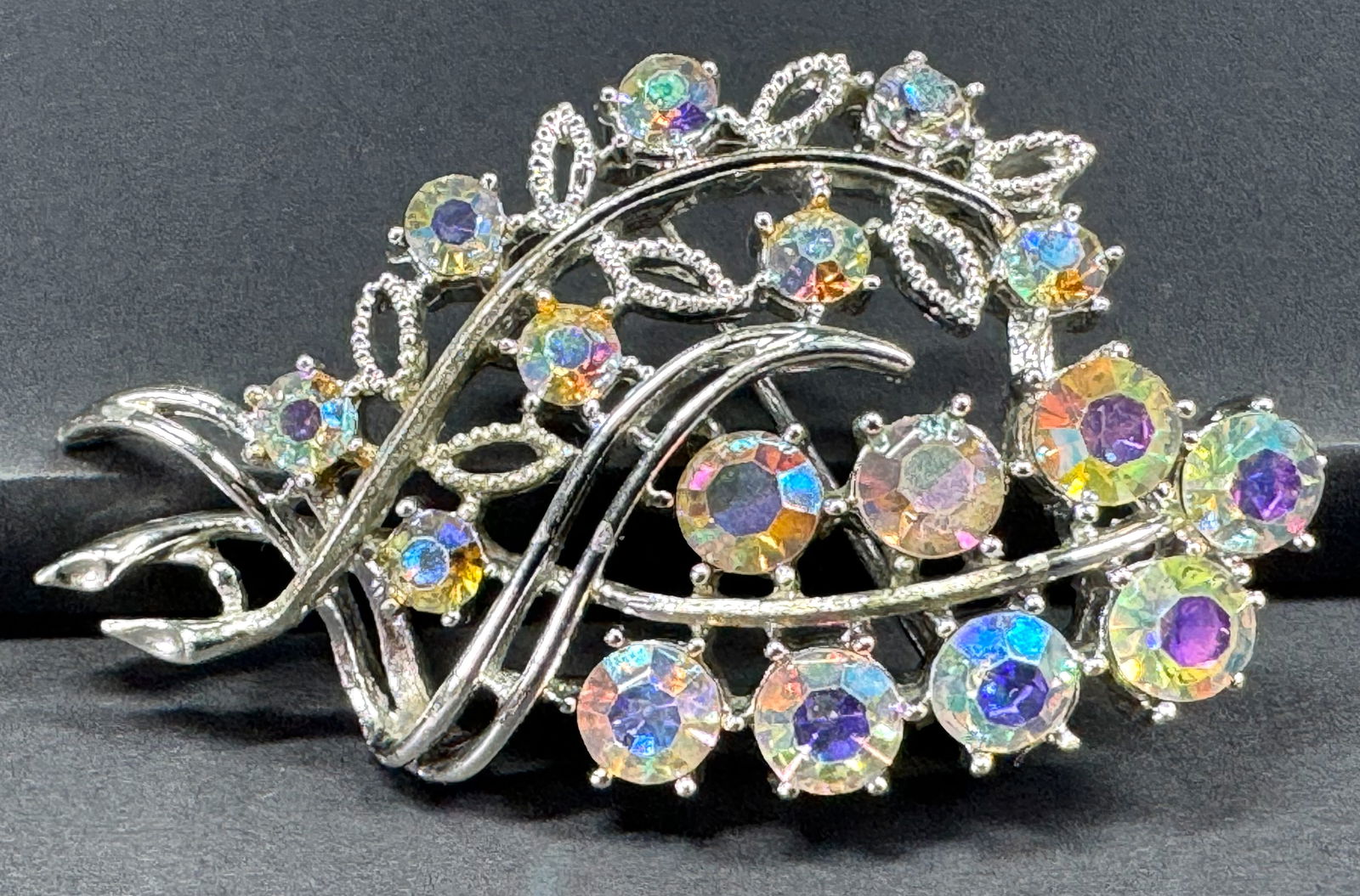 Vintage Coro Pegasus AB crystals silvertone metal flowers bouquet pin brooch.: Vintage Coro Pegasus AB crystals silvertone metal flowers bouquet pin brooch. Marked . For measures please refer to the pictures taken with a measuring tape. Weight: 17 Grams. This is a NO RESERVE AUC