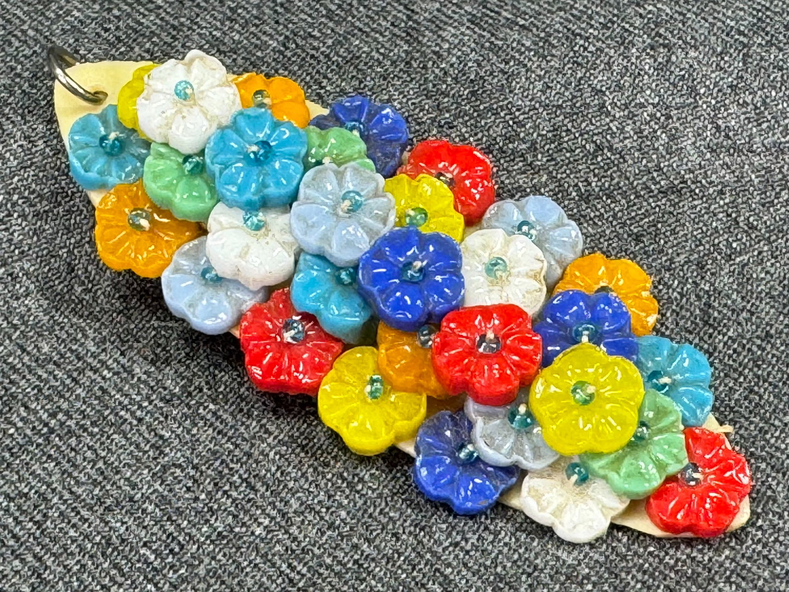 Vintage Czech color glass flowers beaded on celluloid pin brooch pendant.: Vintage Czech color glass flowers beaded on celluloid pin brooch pendant. Unmarked. For measures please refer to the pictures taken with a measuring tape. Weight:10 Grams. This is a NO RESERVE AUCTION