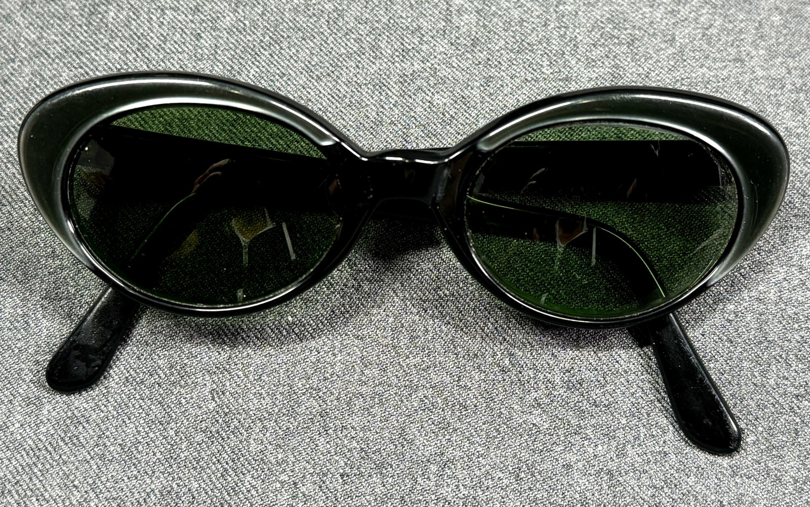 Vintage cat eye pearly green & black celluloid eyeglasses frame.: Vintage cat eye pearly green & black celluloid eyeglasses frame. Marked USA 5 1/2.Prescription green lenses.These are prescription lenses not for wear with the lenses included, so you will need to rep