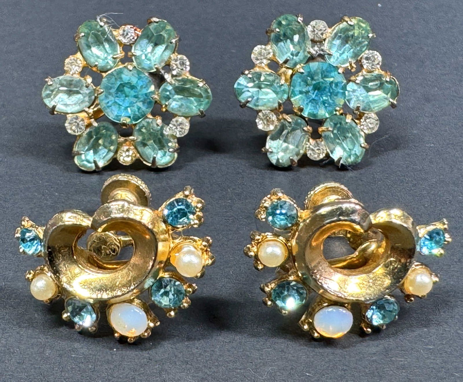 Vintage jeweled Coro sterling flower & goldstone metal screw back earrings: Vintage Coro open back clear & aqua crystals gilt sterling flower and a pearly, opal glass & turquoise crystals goldtone metal screw back earrings. One is marked Coro Sterling, and the other is unmark