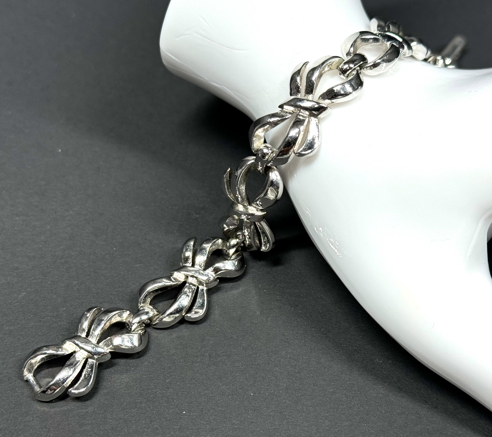 Vintage Crown Trifari silvertone metal ribbons in bow bracelet.: Vintage Crown Trifari silvertone metal ribbons in bow bracelet. Marked. For measures please refer to the pictures taken with a measuring tape. Weight: 11 Grams. This is a NO RESERVE AUCTION: there are