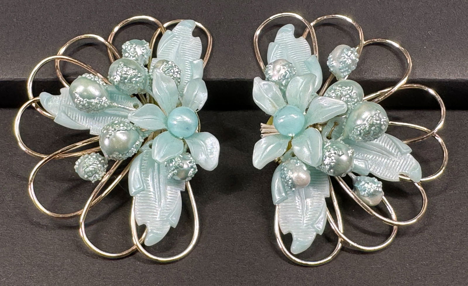 Vintage German skyblue plastic flower & leaves goldtone metal oversized clip earrings (1 of 6)