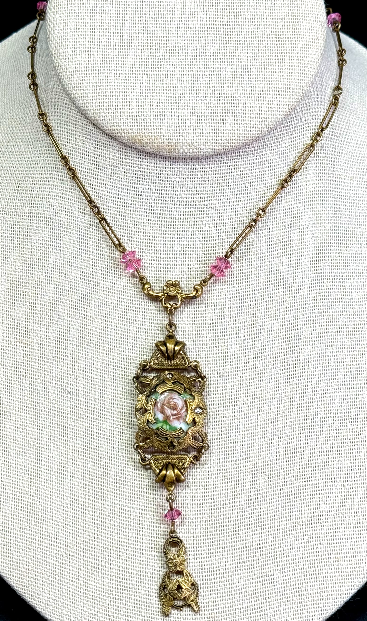 Vintage Victorian style pottery flower filigree goldtone metal pink crystals lavalier necklace.: Vintage Victorian style pottery flower filigree goldtone metal pink crystals lavalier necklace. Unmarked For measures please refer to the pictures taken with a measuring tape. Weight: 10 Grams. This i