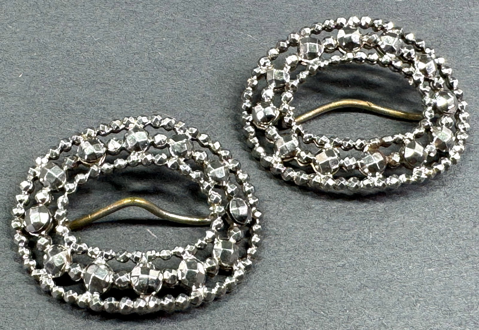 Antique cut steel small shoe buckles.: Antique cut steel small shoe buckles. Unmarked For measures please refer to the pictures taken with a measuring tape. Weight: 7 Grams. This is a NO RESERVE AUCTION: there are no hidden or confidential