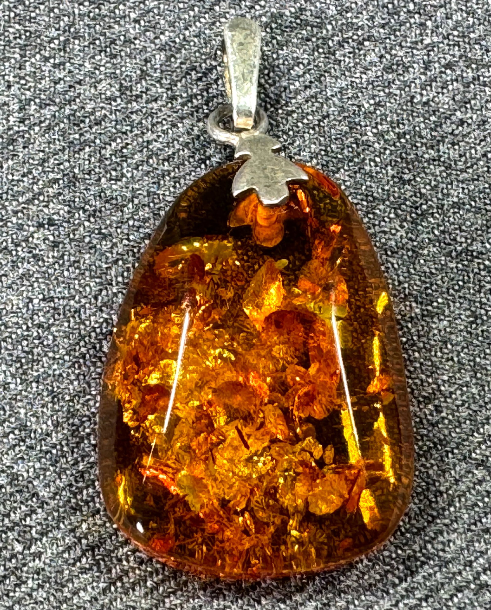 Vintage MCM Baltic amber sterling silver bail pendant. Marked: Vintage MCM Baltic amber sterling silver bail pendant. Marked. For measures please refer to the pictures taken with a measuring tape. Weight: 15 Grams. This is a NO RESERVE AUCTION: there are no hidde