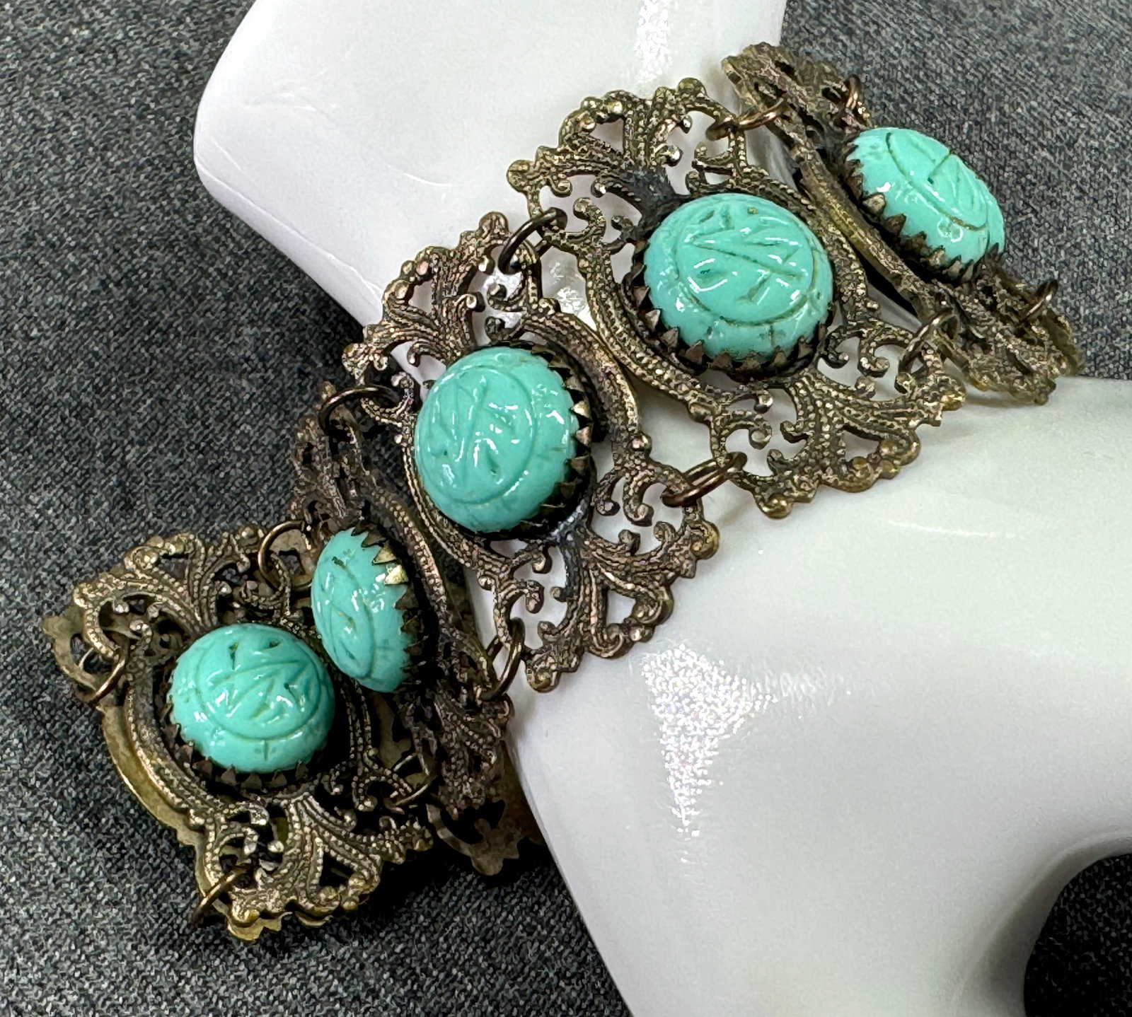 Vintage Czech Egyptian Revival Max Neiger turquoise glass beads filigree metal bracelet: Vintage Czech Egyptian Revival Max Neiger turquoise glass beads filigree metal bracelet. Unmarked. For measures please refer to the pictures taken with a measuring tape. Weight: 29 Grams. This is a NO