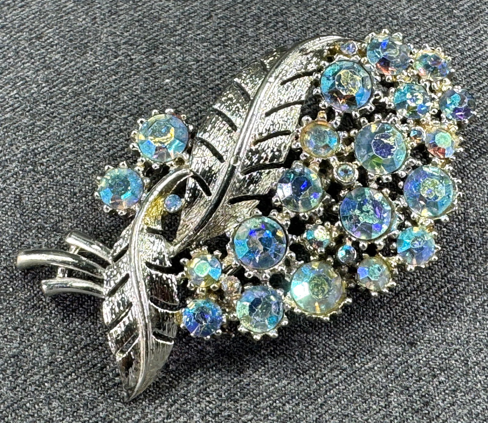 Vintage Coro Pegasus AB crystals silvertone metal flowers & leaves bouquet pin brooch.: Vintage Coro Pegasus AB crystals silvertone metal flowers & leaves bouquet pin brooch. Marked. For measures please refer to the pictures taken with a measuring tape. Weight: 23 Grams. This is a NO RES