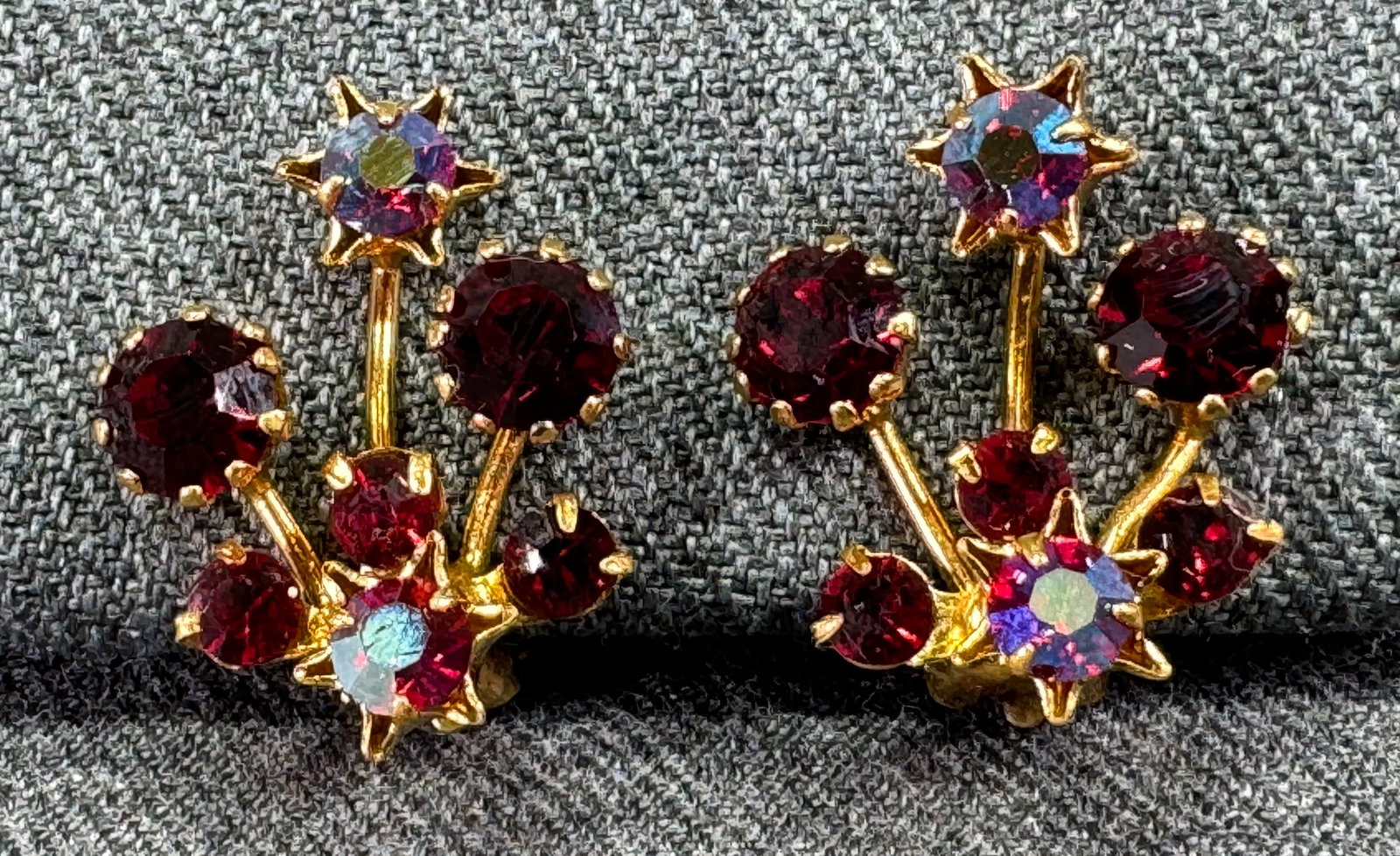 Vintage Austrian AB crystals goldtone metal clip on earrings: Vintage Austrian AB crystals goldtone metal clip on earrings.Marked. For measures please refer to the pictures taken with a measuring tape. Weight: 5 Grams. This is a NO RESERVE AUCTION: there are no 