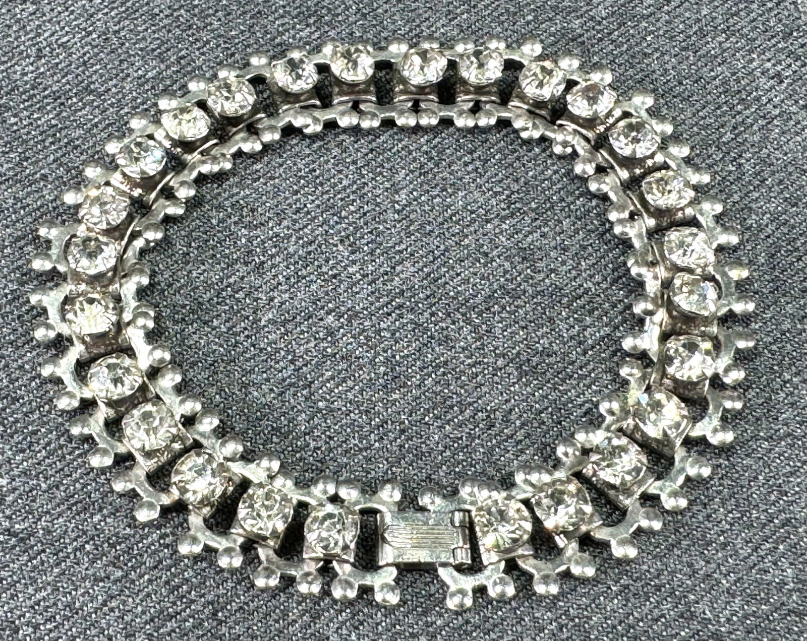 Vintage clear rhinestones silvertone metal book chain bracelet.: Vintage clear rhinestones silvertone metal book chain bracelet. Unmarked. For measures please refer to the pictures taken with a measuring tape. Weight: 16 Grams. Original patina. This is a NO RESERVE