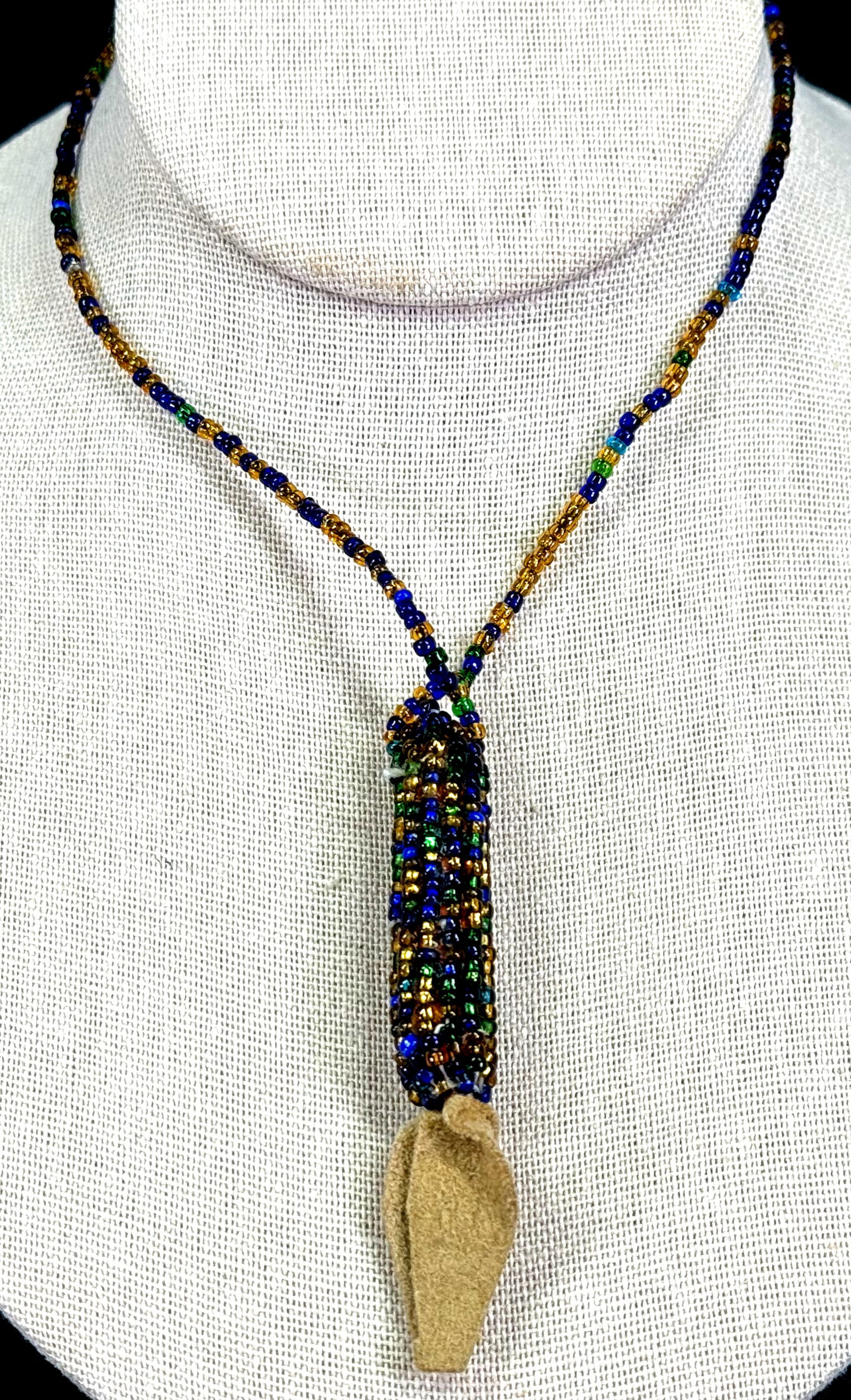 Vintage glass seed beads & genuine suede beadwork indian corn necklace.: Vintage glass seed beads & genuine suede beadwork indian corn necklace. Unmarked. For measures please refer to the pictures taken with a measuring tape. Weight: 10 Grams. This is a NO RESERVE AUCTION: