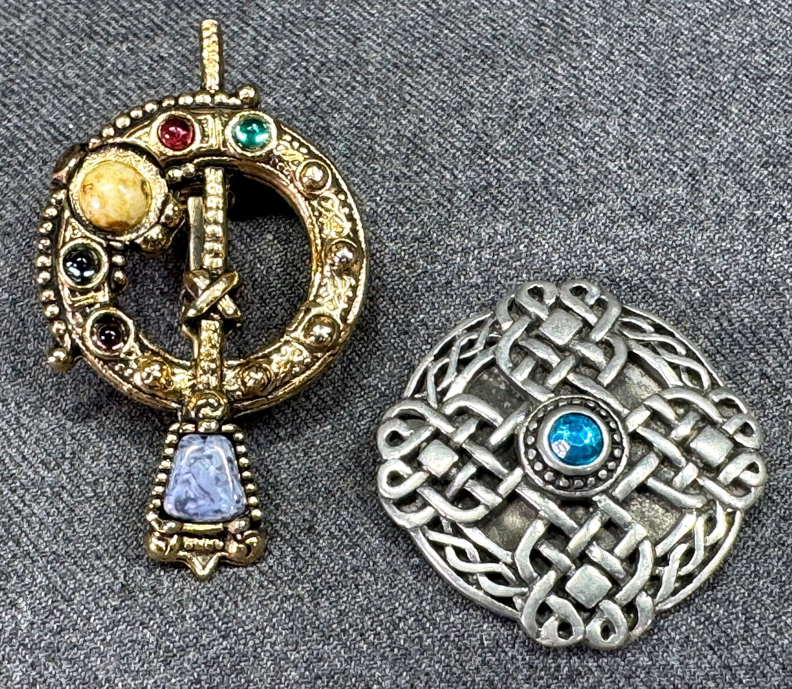 Vintage 80's Celtic jeweled goldtone pin brooch & infinity knots silvertone sliding medallion: Vintage 80's Celtic jeweled goldtone pin brooch & infinity knots silvertone sliding medallion. Unmarked. For measures please refer to the pictures taken with a measuring tape. Weight: 28 Grams This is