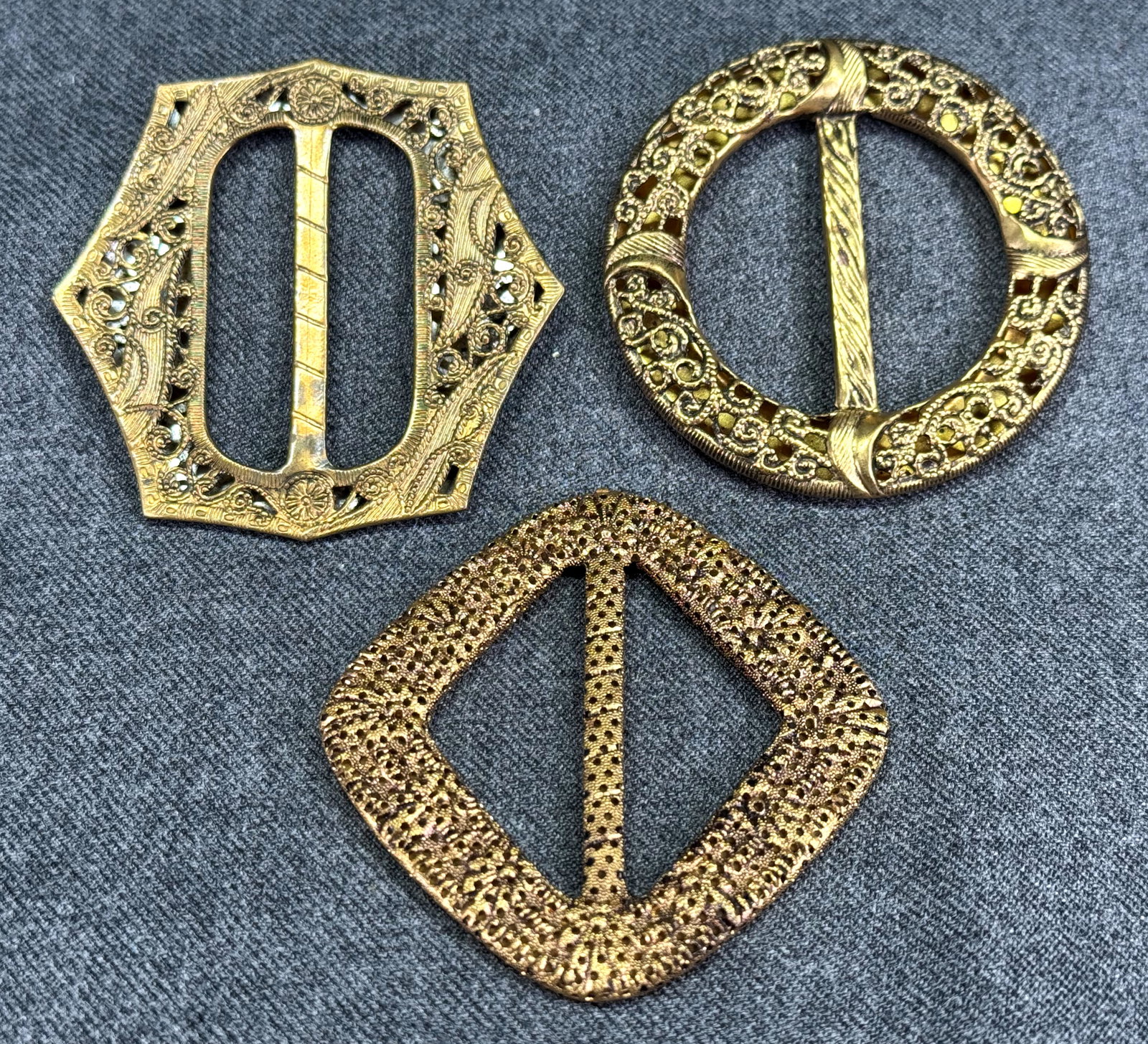 Antique Czech assorted cut-out filigree metal belt buckles sliders. Lot of 3: Antique Czech assorted cut-out filigree metal belt buckles sliders. Lot of 3. Only one of them is marked. For measures please refer to the pictures taken with a measuring tape. Weight: 22 Grams. This 