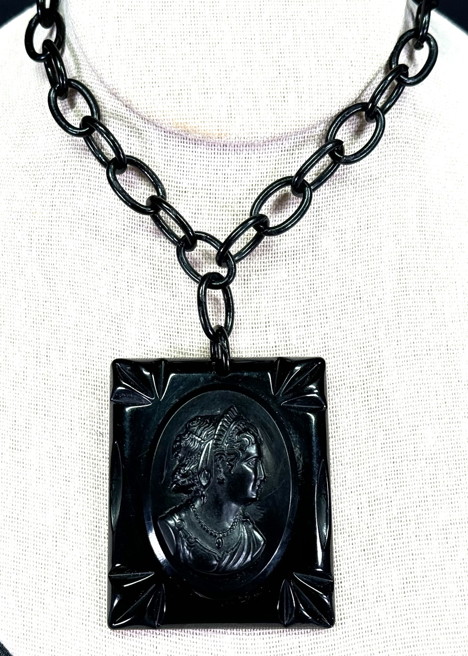 Antique mourning black celluloid cameo medallion with chain necklace.: Antique mourning black celluloid cameo medallion with chain necklace. No clasp. For measures please refer to the pictures taken with a measuring tape. Weight: 32 Grams. This is a NO RESERVE AUCTION: t