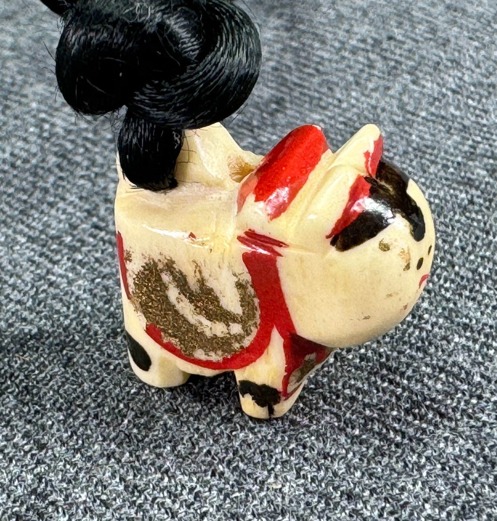 Vintage Japanese painted carved bone lucky cat charm silky black strap necklace: Vintage Japanese painted carved bone lucky cat charm silky black strap necklace. Unmarked. For measures please refer to the pictures taken with a measuring tape. Weight: 6 Grams. This is a NO RESERVE 