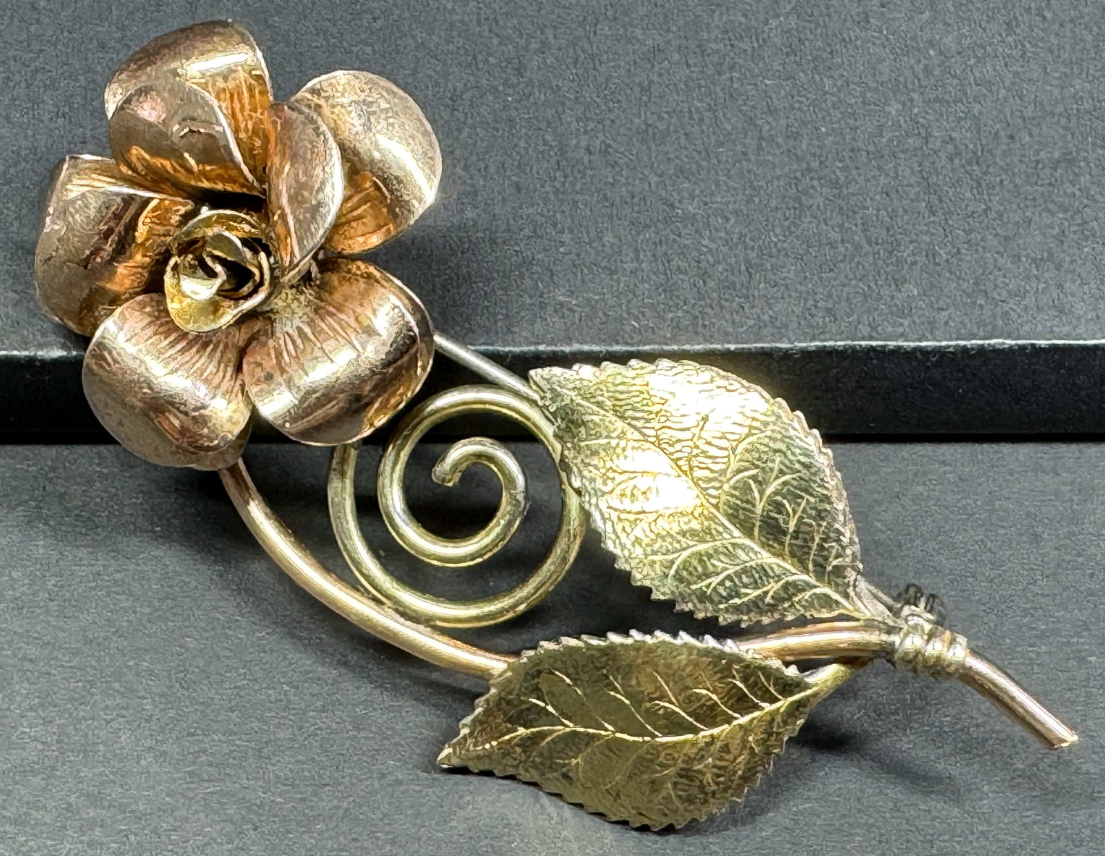 Vintage rose & yellow gold-filled flower & leaves pin brooch. Marked Diana.: Vintage rose & yellow gold-filled flower & leaves pin brooch. Marked Diana. For measures please refer to the pictures taken with a measuring tape. Weight: 10 Grams. This is a NO RESERVE AUCTION: there