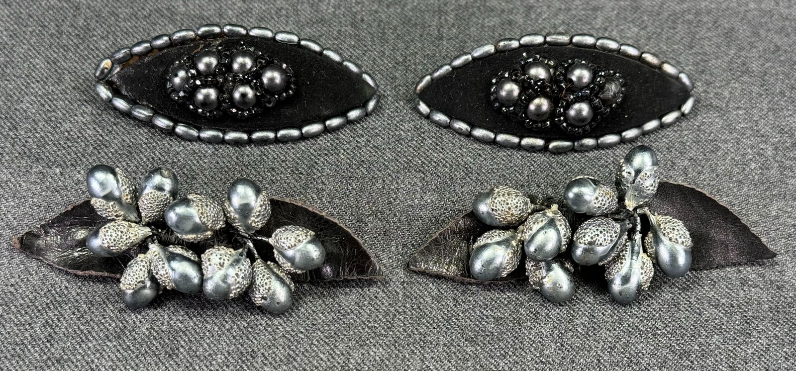 Antique art deco pearly acorn beads leather leaves & woven pearly & black jet suede shoe clips: Antique art deco pearly silver acorn shaped beads black leather leaves & woven pearly silver & black glass jet black suede shoe clips. For measures please refer to the pictures taken with a measuring