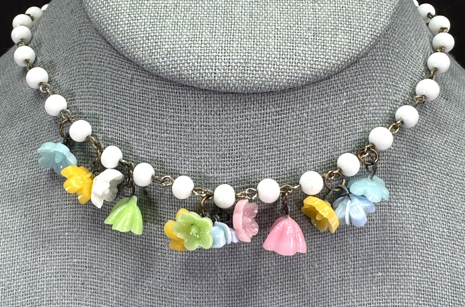 Vintage Haskell style color glass flower dangles, milky white beads collar necklace: Vintage Haskell style color glass flower dangles, milky white beads collar necklace. Unmarked. For measures please refer to the pictures taken with a measuring tape. Weight: 20 Grams. This is a NO RES