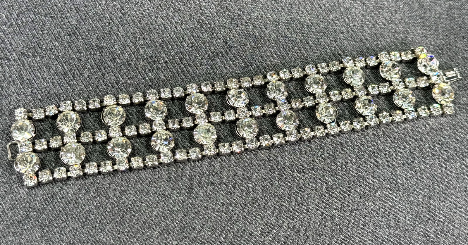 Vintage Kramer style clear crystals silvertone metal wide bracelet.: Vintage Kramer style clear crystals silvertone metal wide bracelet. Unmarked. For measures please refer to the pictures taken with a measuring tape. Weight: 12 Grams. This is a NO RESERVE AUCTION: the