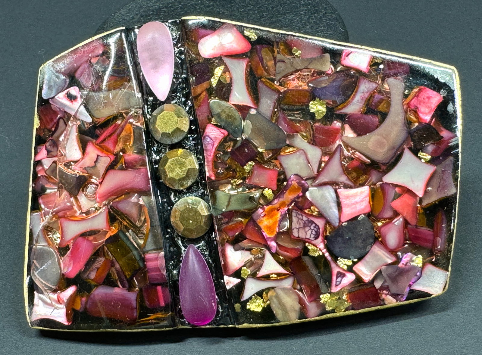 Vintage German artsy inlaid MOP & confetti faceted resin applied beads huge belt buckle / slider: Vintage German artsy inlaid MOP & confetti faceted resin with beads applied huge belt buckle / slider. Back and side painted in golden. Unmarked. Made in Germany Paper label. For measures please refer