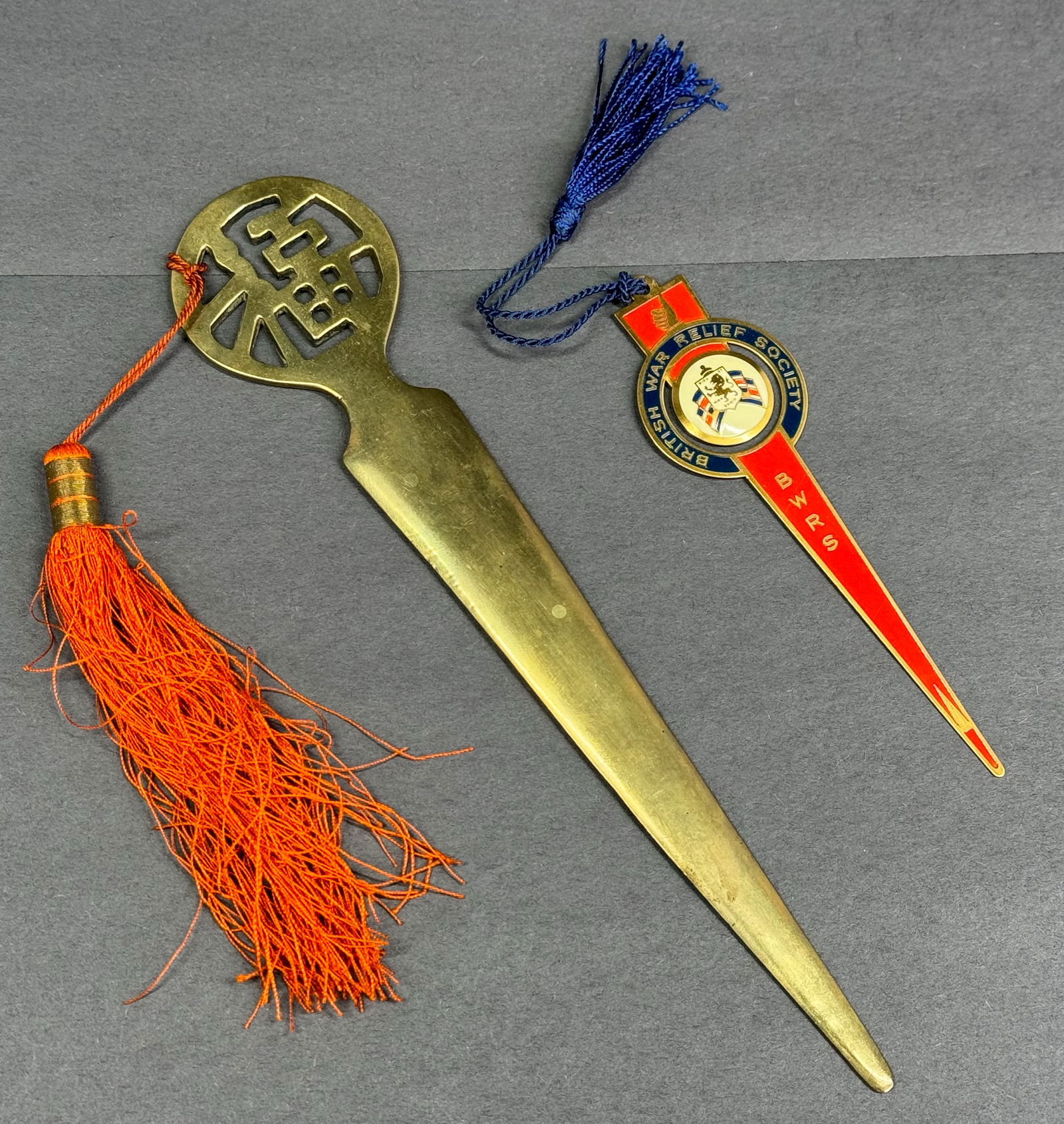 Vintage bronze Chinese letter opener and an enamel metal British War Relief Society Bookmark.: Vintage solid bronze Chinese letter opener and an enamel metal British War Relief Society Bookmark. Both with tassels. The letter opener is marked China and has traces of a paper label. For measures p