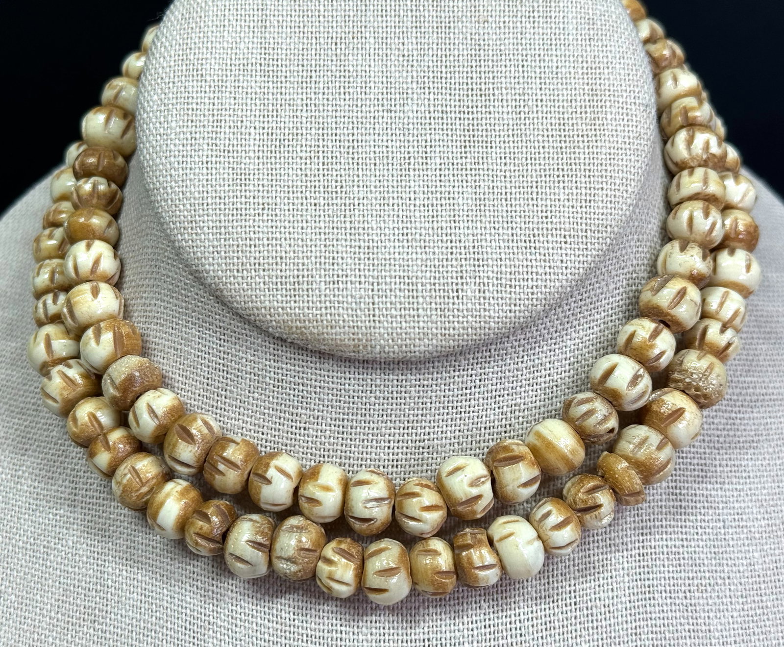 Bone faceted beads strand necklace for jewelry making.: Bone brownish accents stripped beads strand necklace for jewelry making. For measures please refer to the pictures taken with a measuring tape. Weight: 48 Grams. This is a NO RESERVE AUCTION: there ar