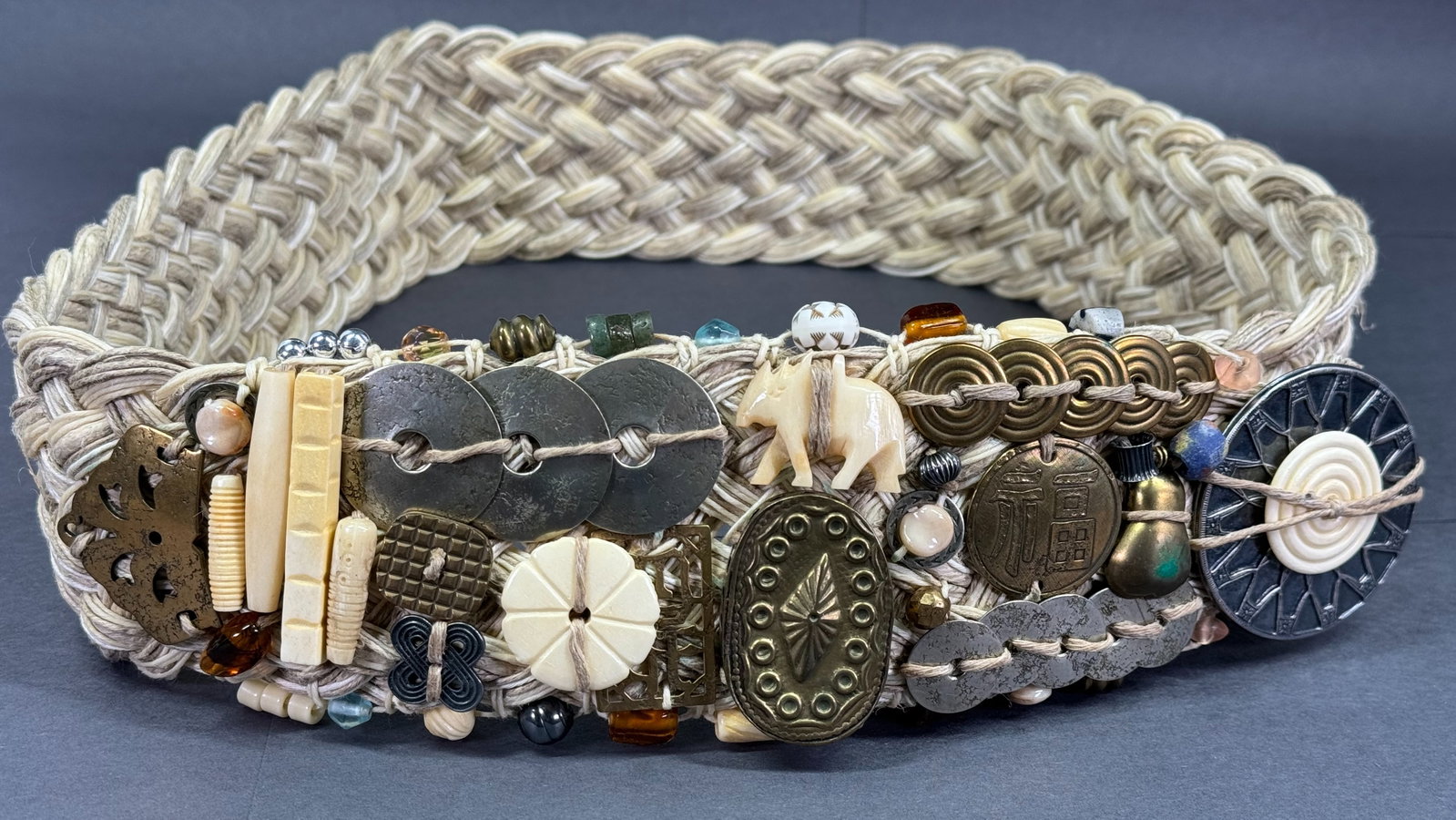 Vintage Marjorie Baer San Francisco braided fibers embellished wide adjustable belt.: Vintage Baer SF Marjorie Baer San Francisco braided of natural fibers embellished with mixed metals & bone wide adjustable belt. Marked. It measures around 40 inches long end to end. For measures plea