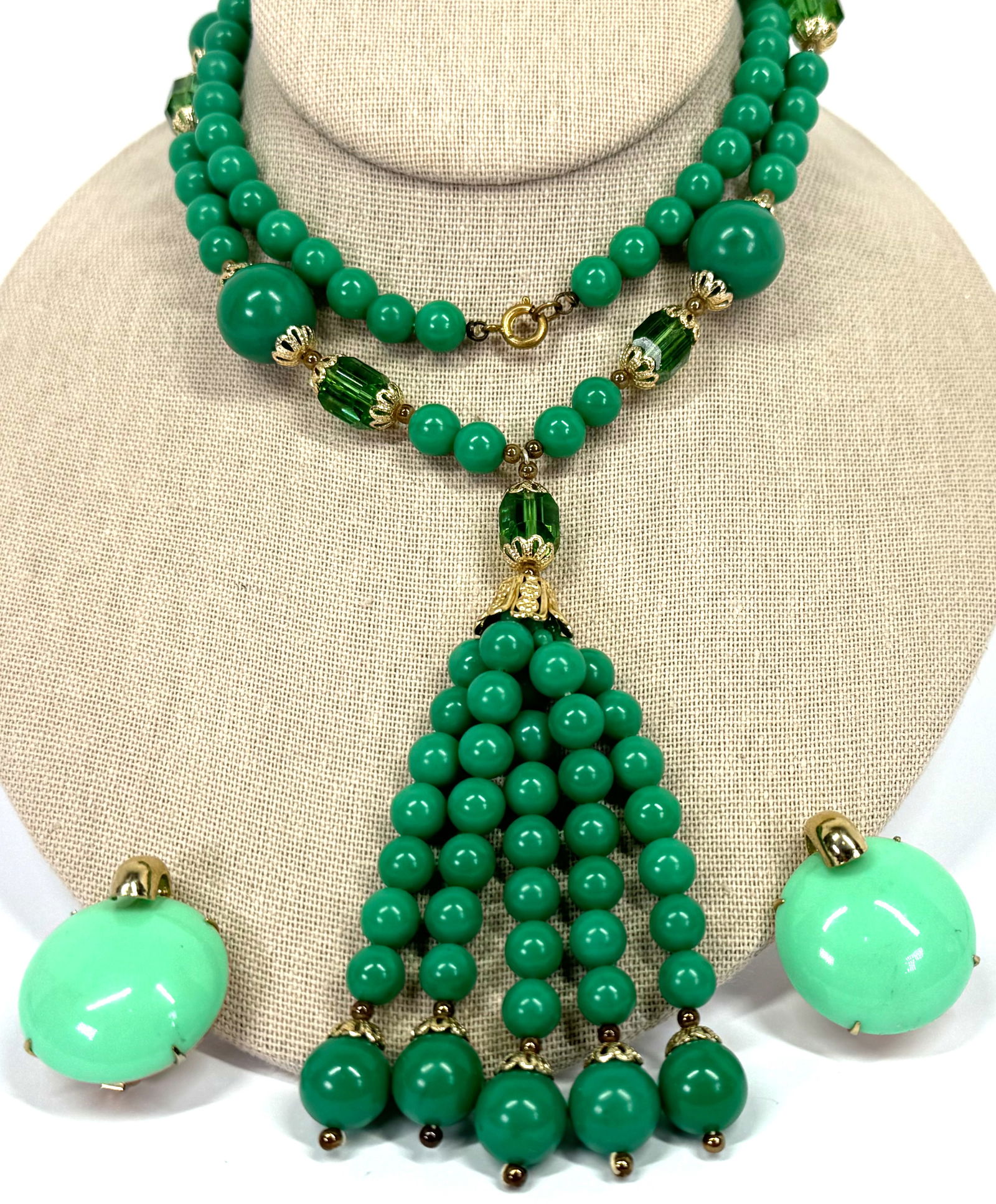 Vintage green plastic & AB crystals lariat necklace and Coro clip earrings.: Vintage green plastic & AB crystals goldtone metal lariat necklace and Coro clip earrings. The necklace is unmarked and the clips are marked Coro. For measures please refer to the picture taken with a