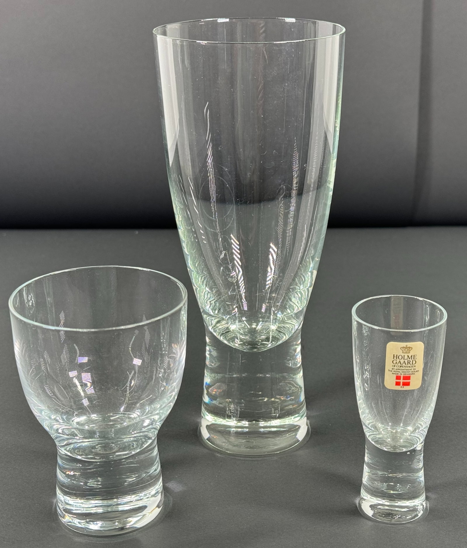 Vintage MCM Danish Holmegaard Denmark Canada Clear Glasses.: Vintage MCM Danish Holmegaard Denmark Canada Clear Glasses. Lot of 3. One of them with paper label. They measure 7 , 3 1/2 and 3 1/4 inches Tall . This is a NO RESERVE AUCTION: there are no hidden or