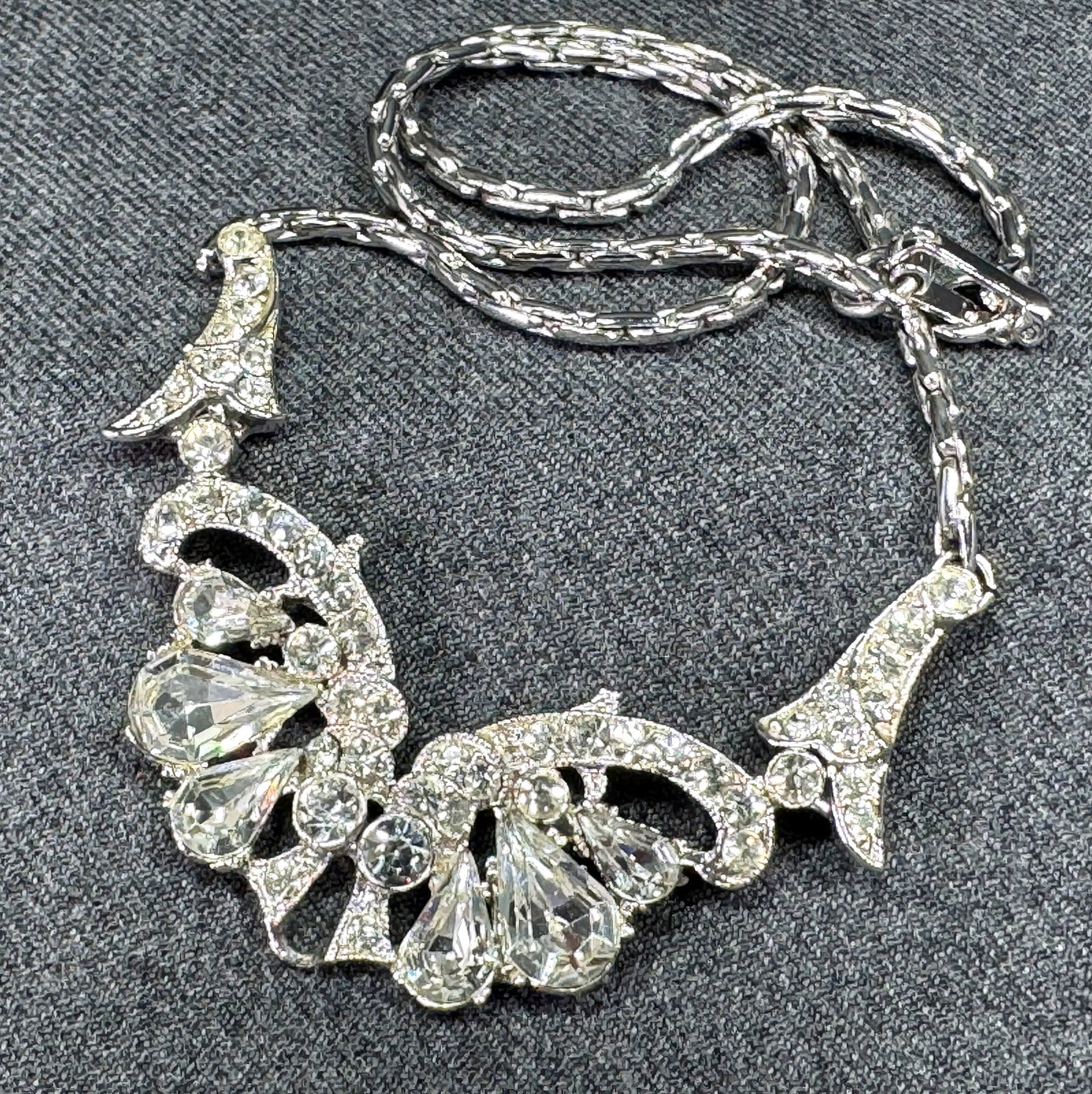 Vintage Kramer style clear crystals silvertone butterfly medallion collar necklace: Vintage Kramer style clear crystals silvertone butterfly medallion collar necklace. Unmarked. For measures please refer to the pictures taken with a measuring tape. Weight: 31 Grams. This is a NO RESE