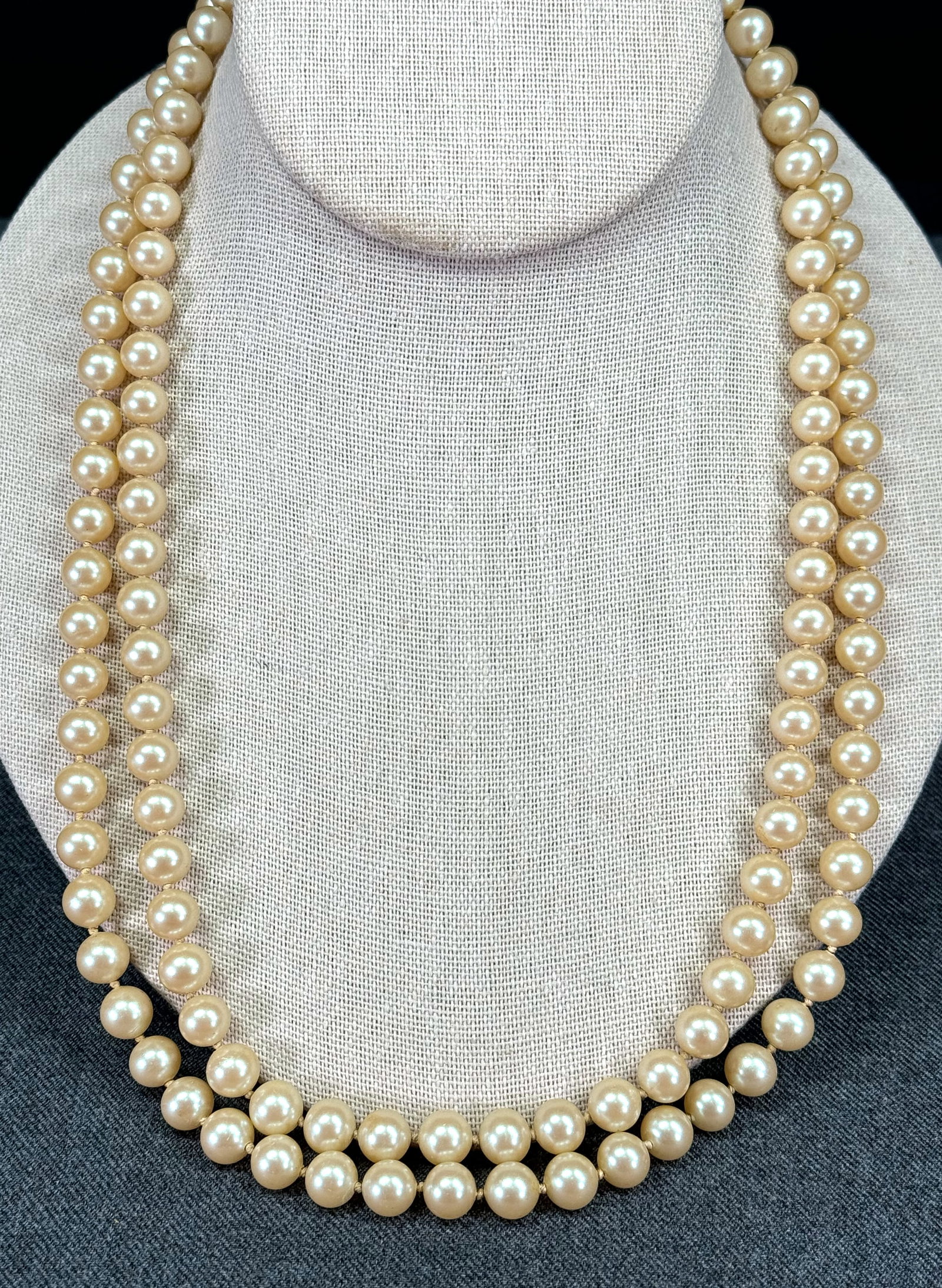 Vintage filigree sterling clasp faux pearls knotted in between beaded 2 strands necklace.: Vintage filigree sterling clasp faux pearls knotted in between beaded 2 strands necklace. Marked . For measures please refer to the pictures taken with a measuring tape. Weight: 85 Grams. This is a NO