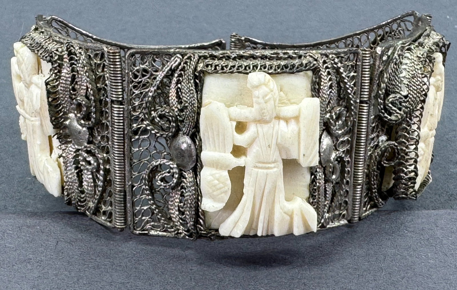 China Export carved bone panels filigree silver bracelet.: China Export carved bone panels filigree silver bracelet. Marked China . For measures please refer to the pictures taken with a measuring tape. Weight: 33 Grams. This is a NO RESERVE AUCTION: there ar