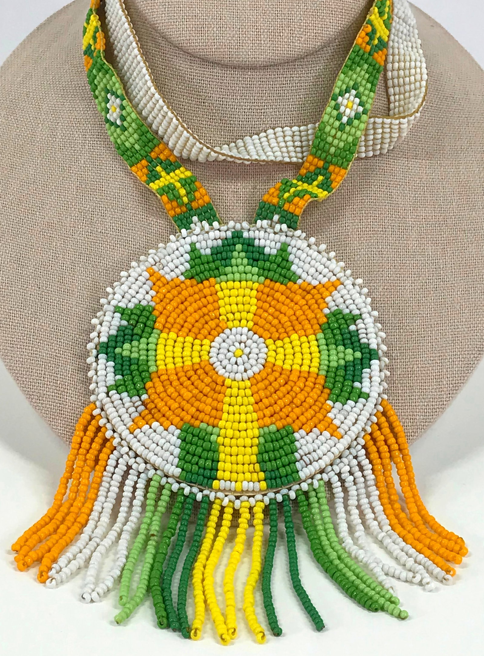 Vintage native american seed glass beads rosette necklace: Vintage native american seed glass beads rosette medallion with fringe necklace. Unmarked. For measures please refer to the picture taken with a measure tape. Weight: 90 Grams. This is a NO RESERVE AU