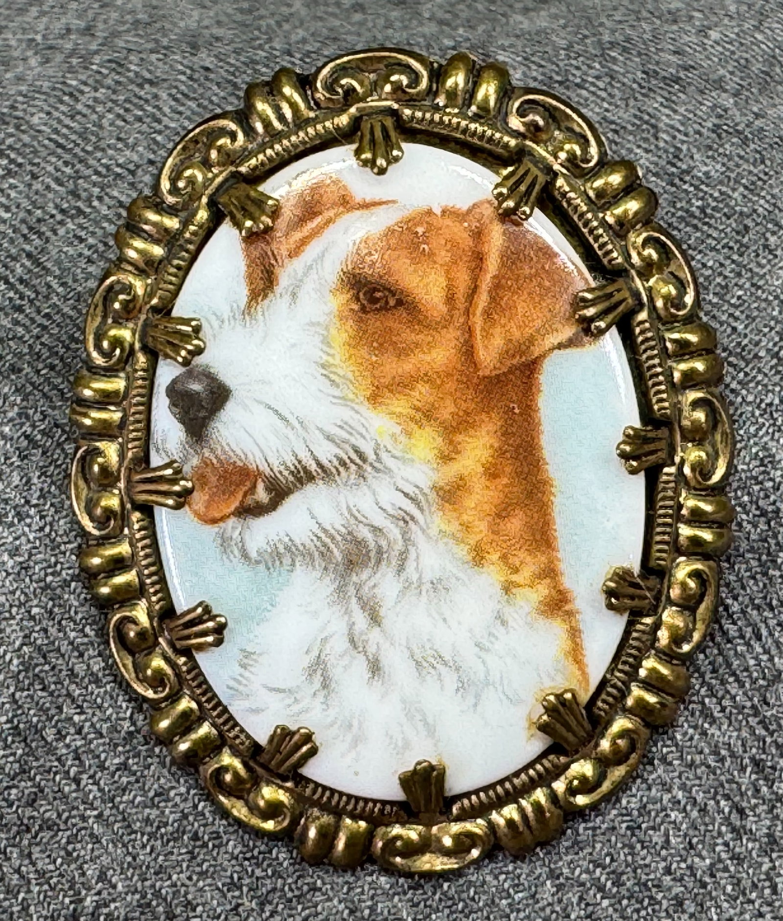 Vintage Western Germany fox terrier dog medallion goldtone metal set pin brooch: Vintage Western Germany fox terrier dog medallion goldtone metal set pin brooch. Marked. For measures please refer to the picture taken with a measuring tape. Weight: 12 Grams. IN HOUSE Estimated* shi