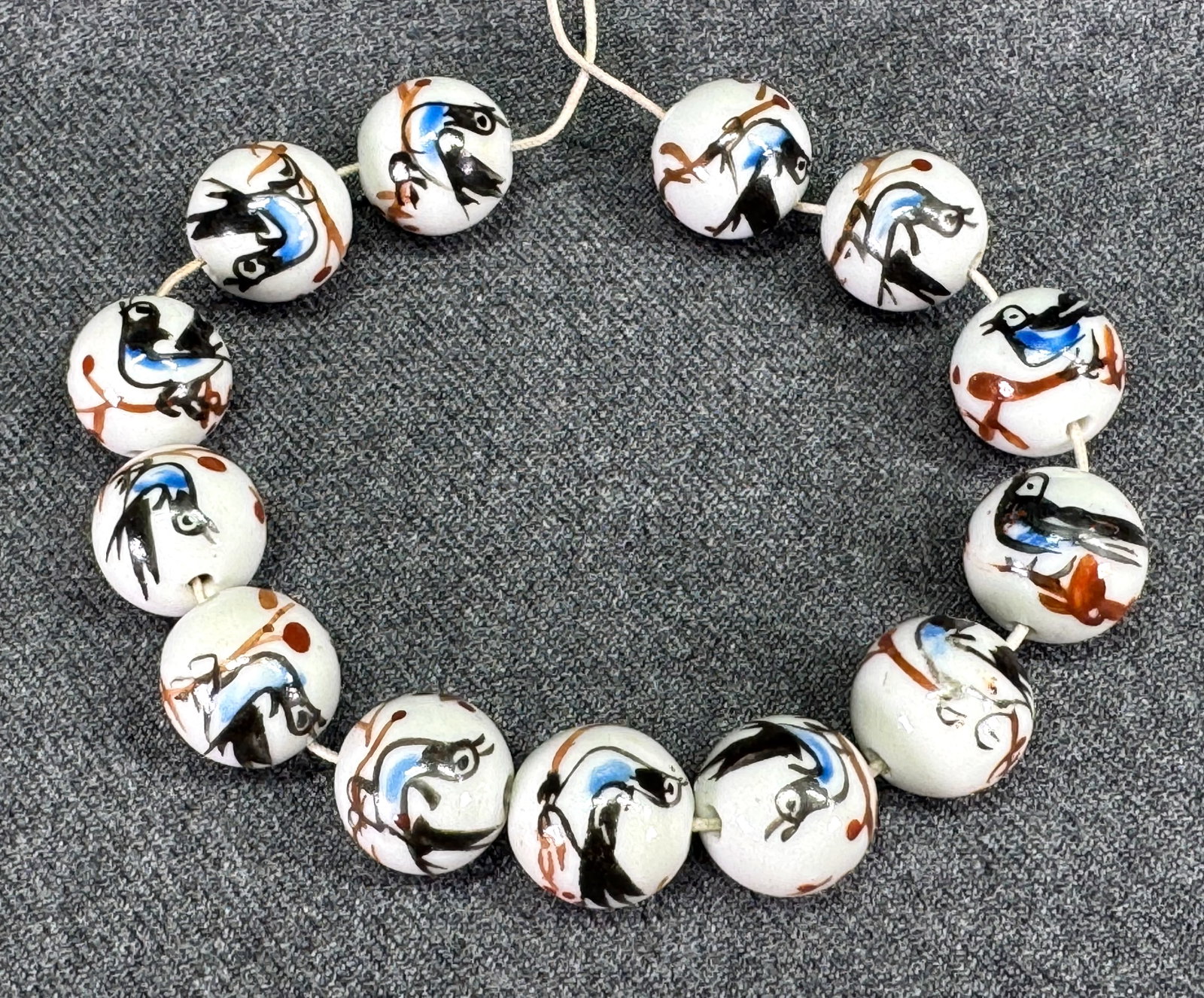 Painted birds & branches porcelain loose beads jewelry making. Lot of 13: Painted birds & branches porcelain loose beads jewelry making. Lot of 13. Unmarked, For measures please refer to the picture taken with a measuring tape. Weight: 32 Grams. IN HOUSE Estimated* shipping