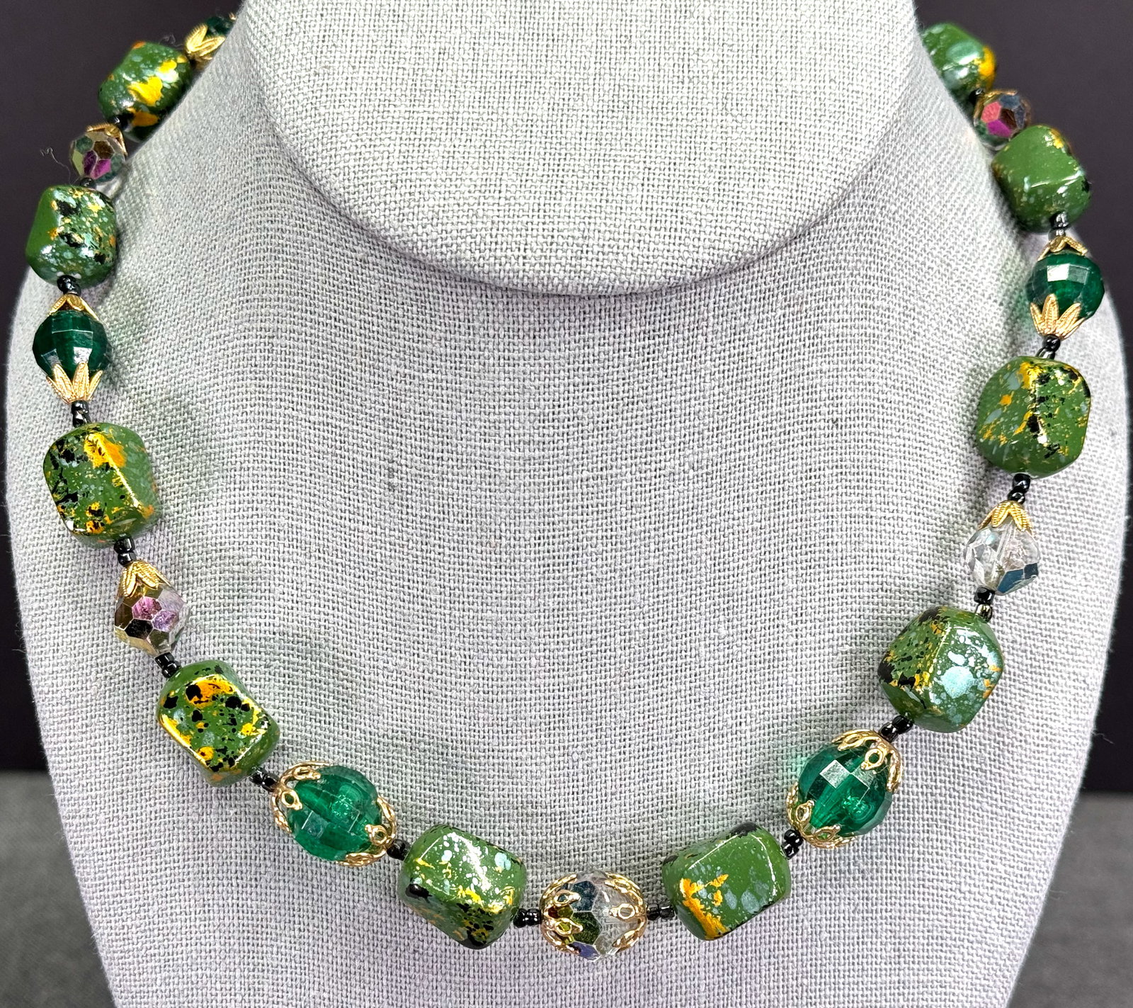 Vintage AB crystals, greenish & golden plastic beads filigree clasp collar necklace: Vintage AB crystals, greenish & golden plastic beads filigree clasp collar necklace. Unmarked. For measures please refer to the pictures taken with a measuring tape. Weight: 30 Grams. This is a NO RES