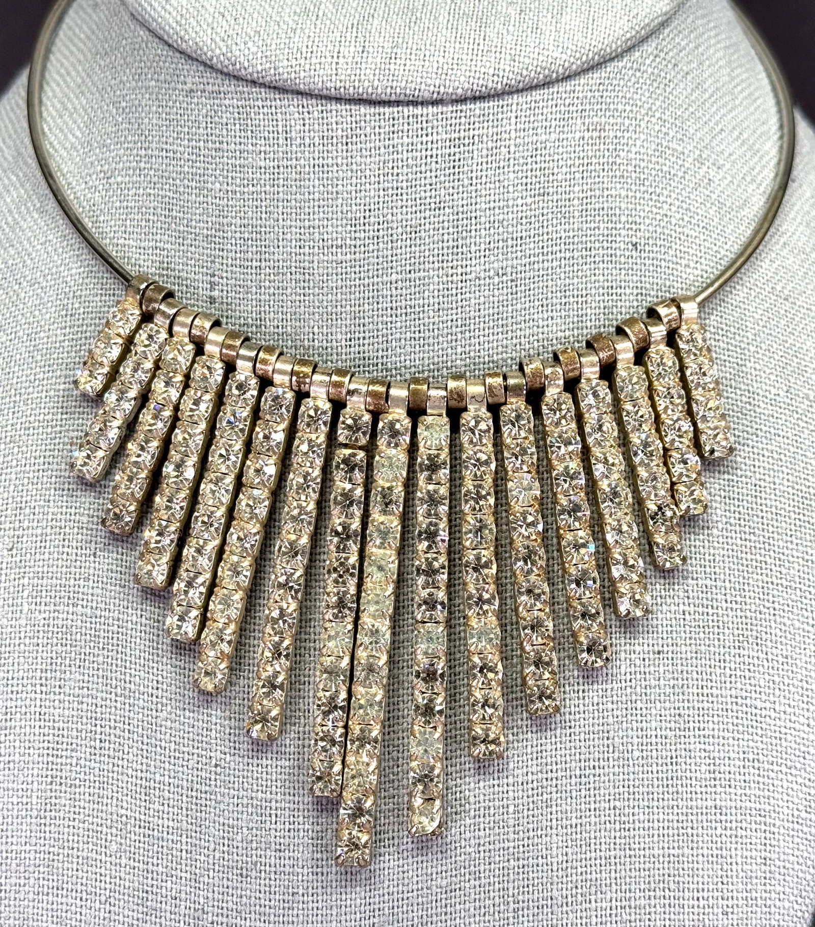 Vintage Egyptian revival clear rhinestones silvertone metal sliding dangles choker necklace: Vintage Egyptian revival clear rhinestones silvertone metal sliding dangles choker necklace. Unmarked. For measures please refer to the pictures taken with a measuring tape. Weight: 47 Grams. IN HOUSE