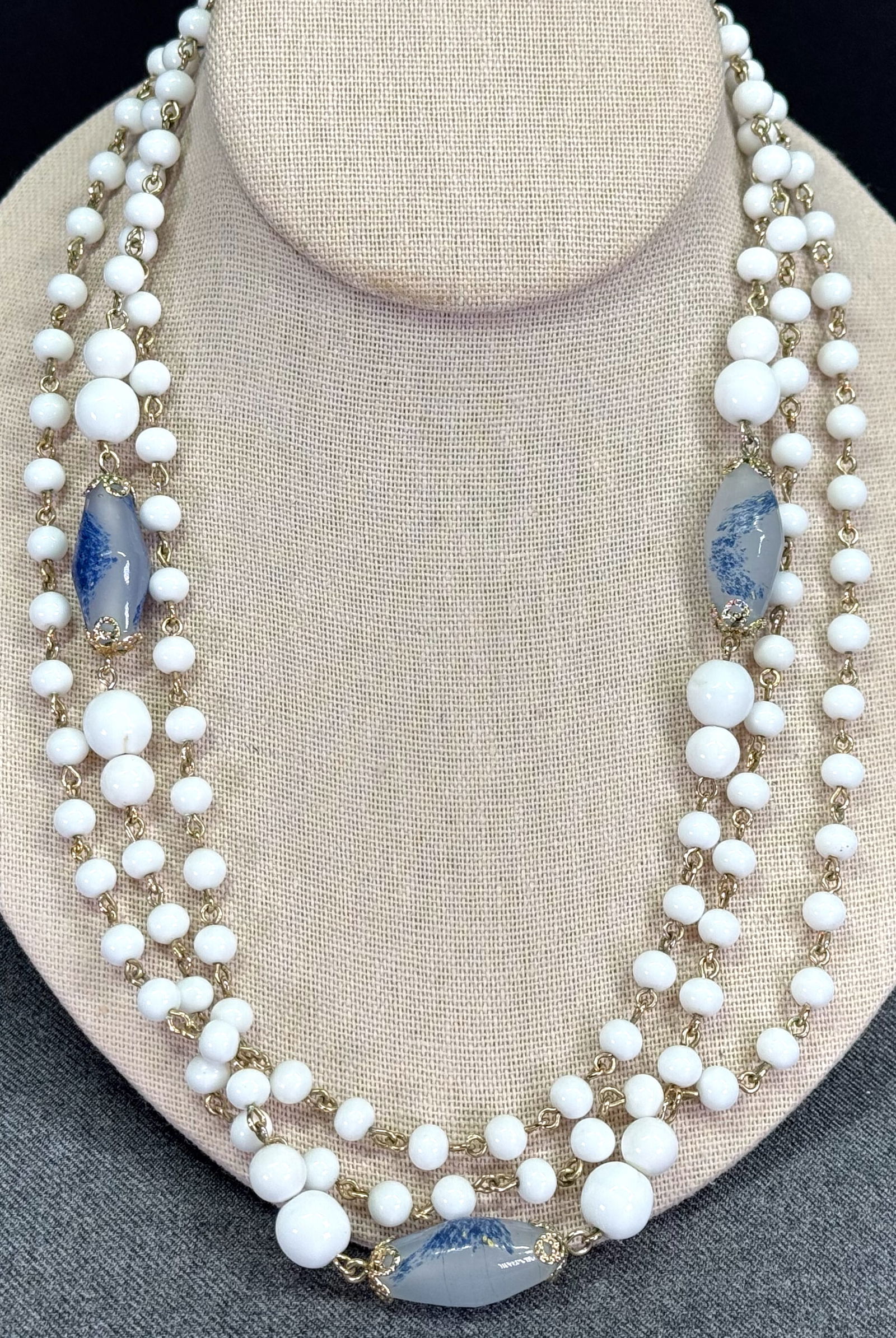Vintage Coro flapper style goldtone wired bluish & milky glass beads necklace: Vintage Coro flapper style goldtone wired bluish & milky glass beads necklace. Marked on clasp/. For measures please refer to the pictures taken with a measuring tape. Weight: 73Grams. This is a NO RE