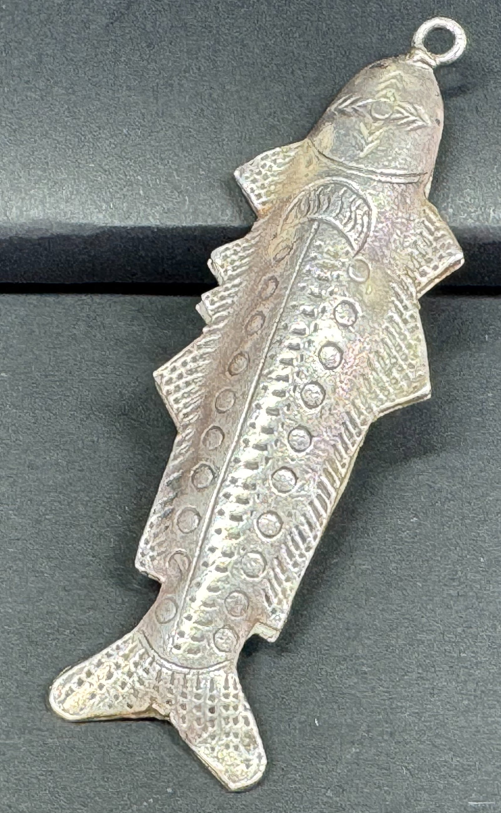 Vintage tribal pewter fish pendant.: Vintage tribal pewter fish pendant. Unmarked . For measures please refer to the pictures taken with a measuring tape. Weight: 15 Grams. This is a NO RESERVE AUCTION: there are no hidden or confidentia