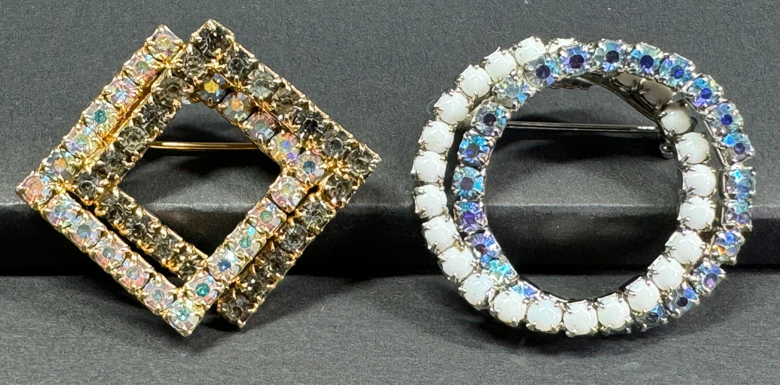 Vintage Interlocking AB crystals squares & AB crystals & milky glass circles pin brooches.: Vintage Interlocking AB crystals goldtone metal squares & AB crystals & milky glass silvertone metal circles pin brooches. Unmarked. For measures please refer to the pictures taken with a measuring ta