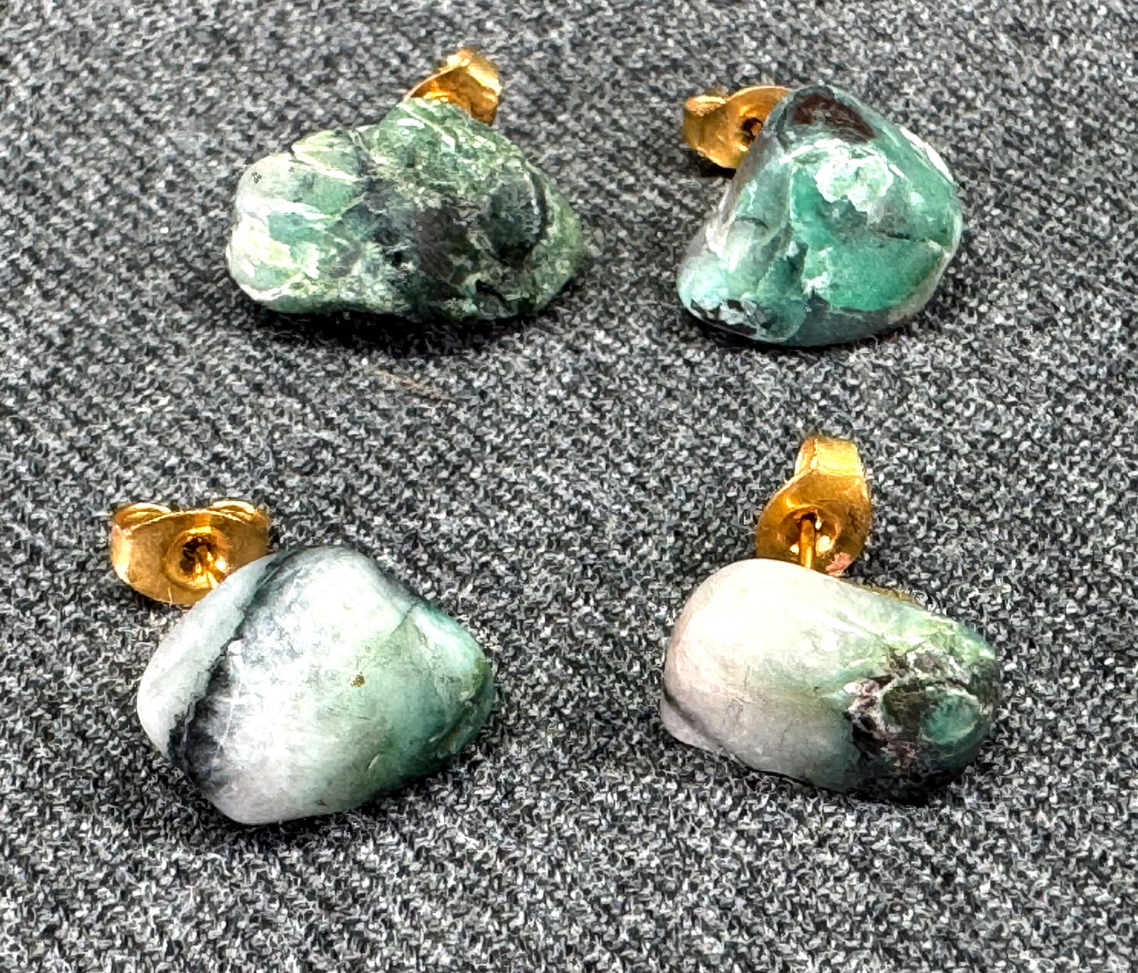 Vintage tumbled emerald stone assorted stud earrings. Lot of 2: Vintage tumbled emerald stone assorted stud earrings. Lot of 2. For measures please refer to the pictures taken with a measuring tape. Weight: 5 Grams. IN HOUSE Estimated* shipping and handling cost w