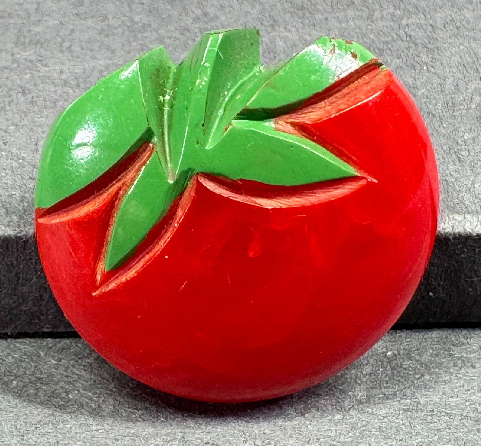 Vintage painted red bakelite tomato pin brooches.: Vintage painted red bakelite (tested) tomato pin brooches. For measures please refer to the pictures taken with a measuring tape. Weight: 4 Grams. This is a NO RESERVE AUCTION: there are no hidden or 