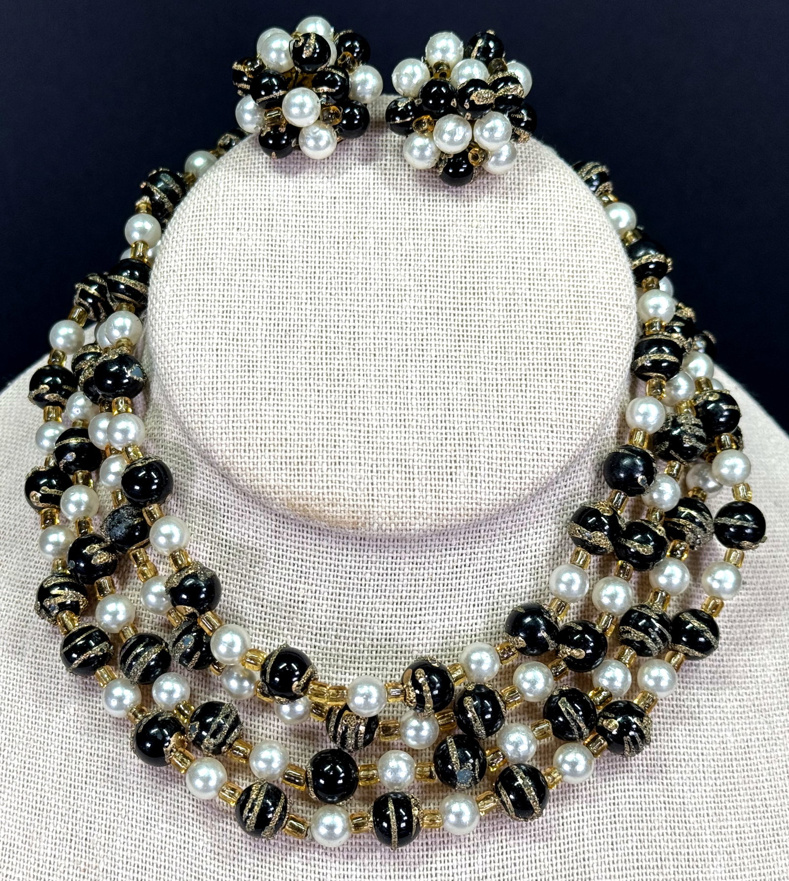 Vintage Japanese golden glitter black & pearly plastic beads two necklaces and clip on earrings: Vintage Japanese golden glitter black & pearly plastic and amber seed glass beads two necklaces and clip on earrings. The clips are marked Japan.br> For measures please refer to the pictures taken wit