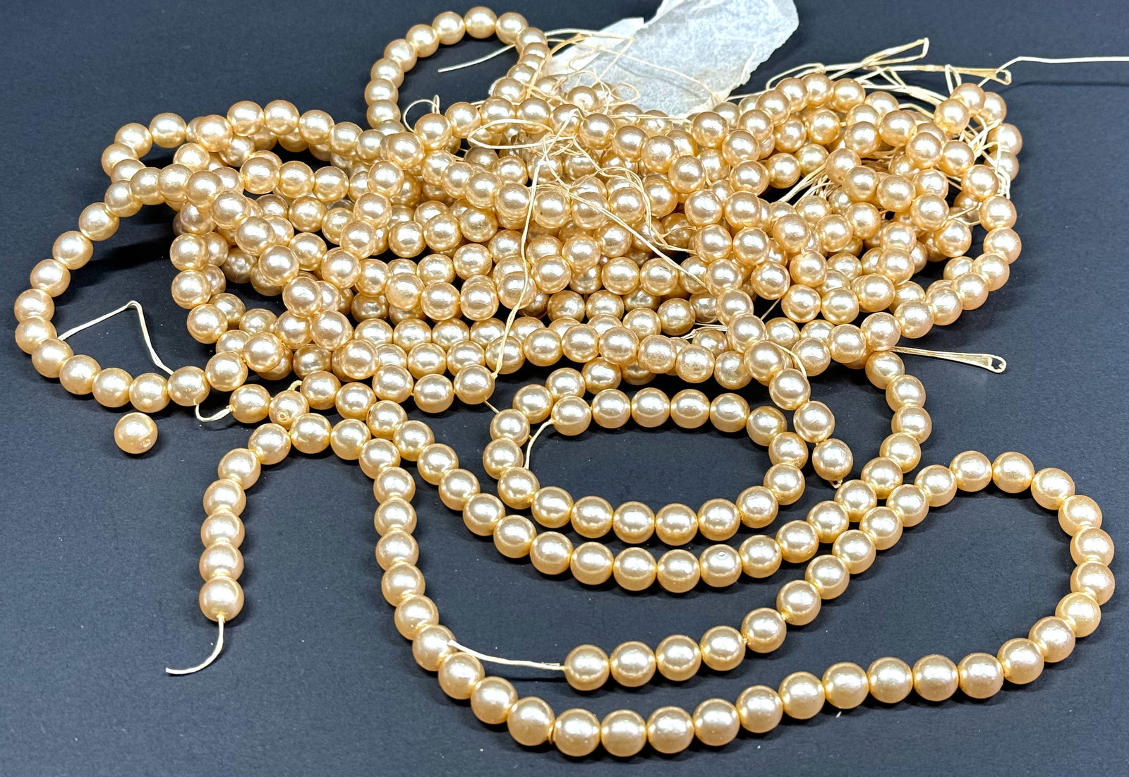 Vintage faux pearl beads strands for jewelry or craft making. Lot of 9. Each measures 16 inches long: Vintage faux pearl beads strands for jewelry or craft making. Lot of 9. Each measures 16 inches long. 16 Oz For measures please refer to the pictures taken with a measuring tape. Shoes with stains and