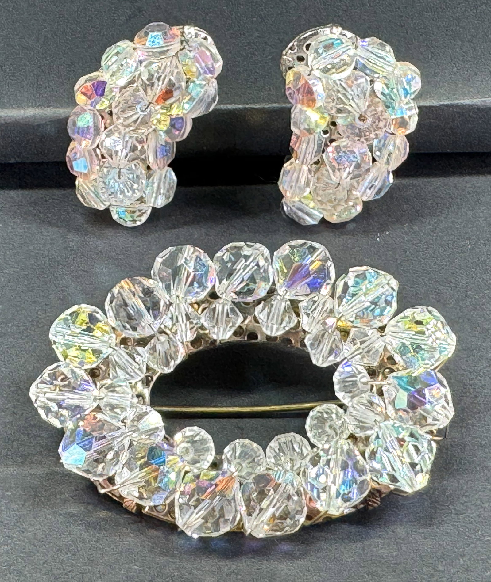 Vintage assorted wired AB faceted crystal beads pin brooch & clip earrings.: Vintage assorted wired AB faceted crystal beads pin brooch & clip earrings. Unmarked. Brooch is goldtone and the clips are silvertone. For measures please refer to the pictures taken with a measuring 